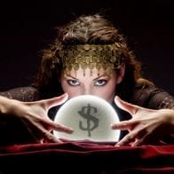 Financial Forecast for 2014 Psychic with hands around crystal ball with a dollar sign