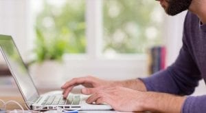 Man on Computer applying for a Home Equity Line of Credit