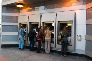 Customers using bank ATMs