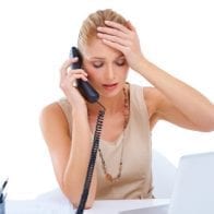 10 Biggest Mistakes People Make When Paying Off Debt Stressed Woman with Paperwork