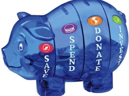 Former Bank Vice President Teaches Kids Basics of Finance piggy bank