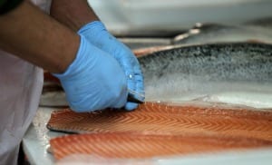 With the Cost of College Going Up, is It Worth the Expense? A college degree is no guarantee you'll make more than minimum wage, which you can make by cutting fish.