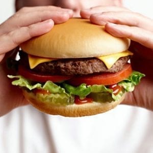 Cheeseburger in hand