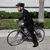 Frugal Man Rides His Bike to Work for ‘The Exercise’ Man riding a bike to work