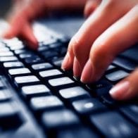 Blogging About Finances, Debt from a Personal Perspective Fingers typing on keyboard