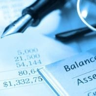 Financial Advice for Dealing with Irregular Business Income Pen on a balance sheet