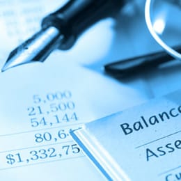 Pen on a balance sheet