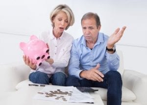 retired couple counting money