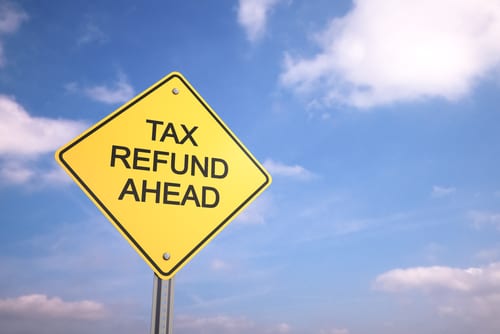road sign with tax refund written on it