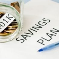 Employers Up The Ante On 401k Plans Jar full of coins intended for a 401K savings plan