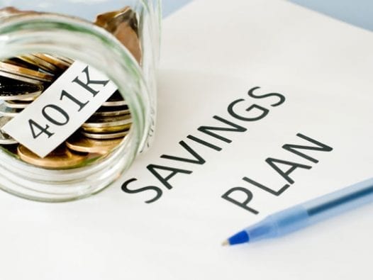 Employers Up The Ante On 401k Plans Jar full of coins intended for a 401K savings plan