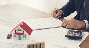 Man filling out paperwork - Home Equity Loan