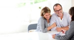Happy Couple looking at different mortgages