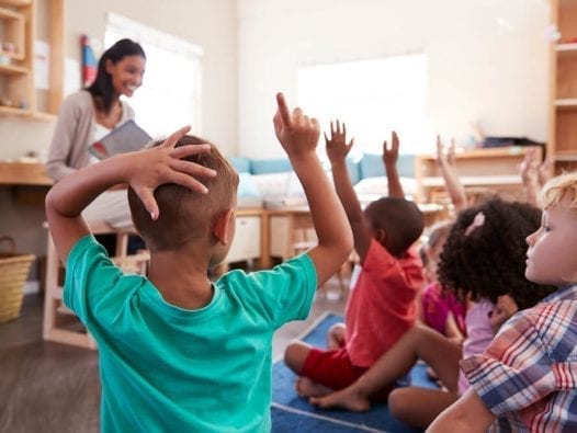 The Future of the Public Service Loan Forgiveness Program Teacher in Classroom with Students