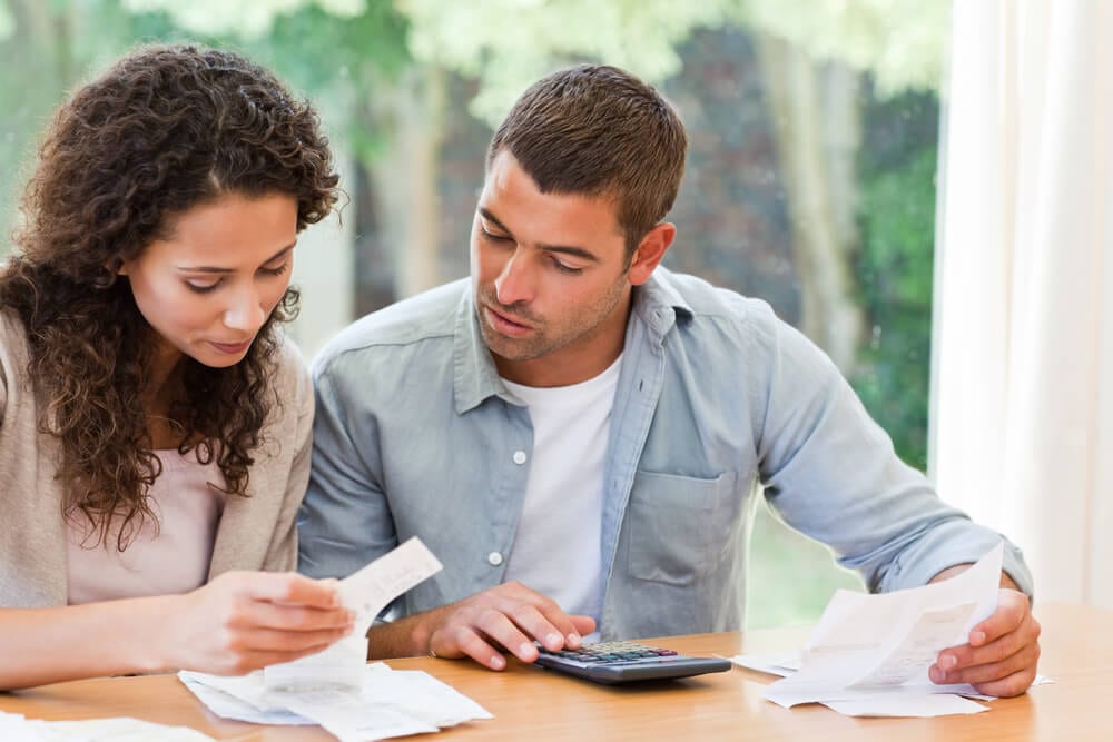 couple-with-bills-and-calculator