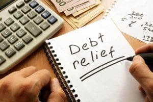 Debt relief program with papers and calculator