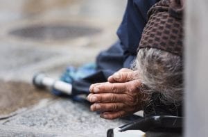 Homeless women laying down showing poverty in the United States