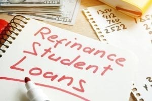 Student Loan Refinance written on paper on top of desk