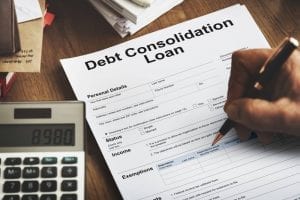Man with bad credit signing debt consolidation loan documents