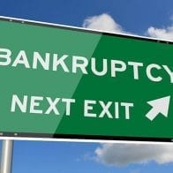 In Era of Trump, Has Bankruptcy Stigma Lost Its Sting? Highway exit sign with arrow to bankruptcy