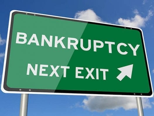 In Era of Trump, Has Bankruptcy Stigma Lost Its Sting? Highway exit sign with arrow to bankruptcy