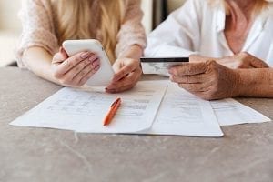 A senior receiving credit counseling for credit card debt