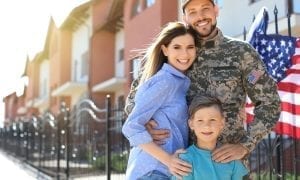 American soldier family photo outside of apartments