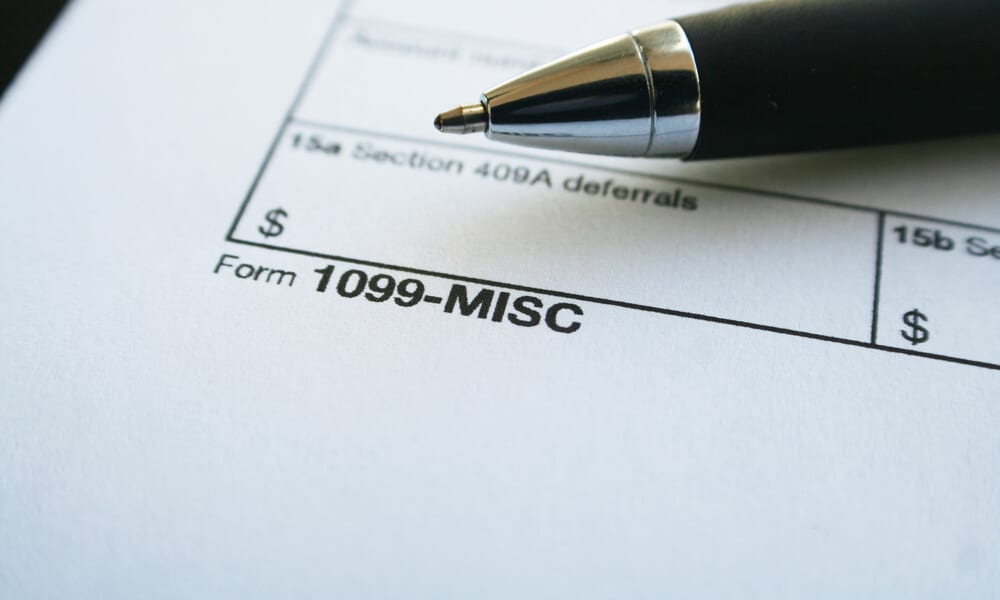 Close up of form labeled "1099-MISC" with a pen sitting atop it