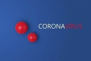 Red virus on blue background with words "CORONAVIRUS"