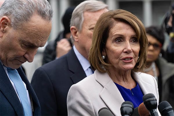 Nancy Pelosi at a podium