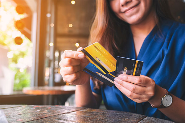 Woman transferring the balance of one credit card to another