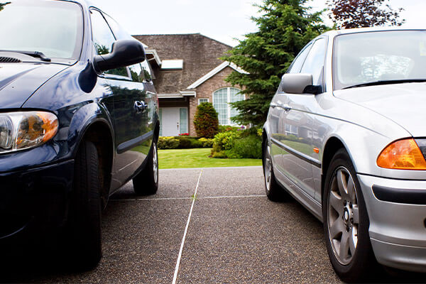 Cars parked in driveway
