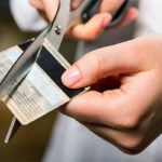 Cutting a credit card with scissors