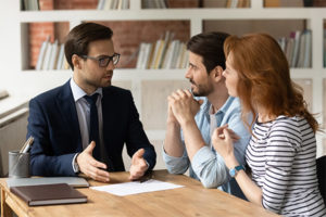 Bankruptcy lawyer explaining to clients about taxes