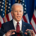 President Joe Biden giving a speech behind a podium