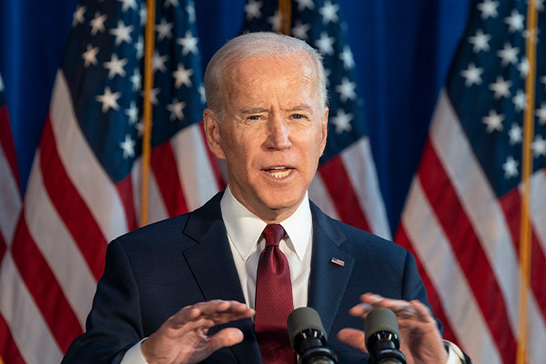 President Joe Biden giving a speech behind a podium