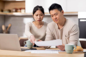 Couple discussing whether or not they should use a personal loan to pay off credit cards