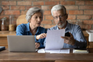 Elderly couple checking social security paperwork