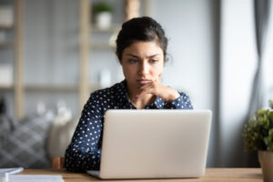 Woman searching online for her debts