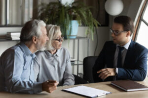 Couple discussing a reverse mortgage with their lender