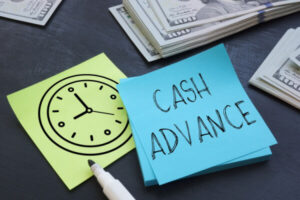 Sticky note with cash advance written on it