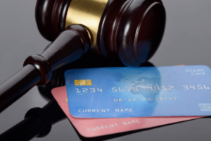 Wooden Gavel With Credit Card.
