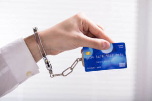 An Arrested Person Hand Linked To Credit Card.
