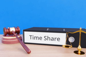 Timeshare folder with labeling, gavel and libra representing refusal to inherit.