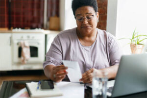Woman looking at paycheck